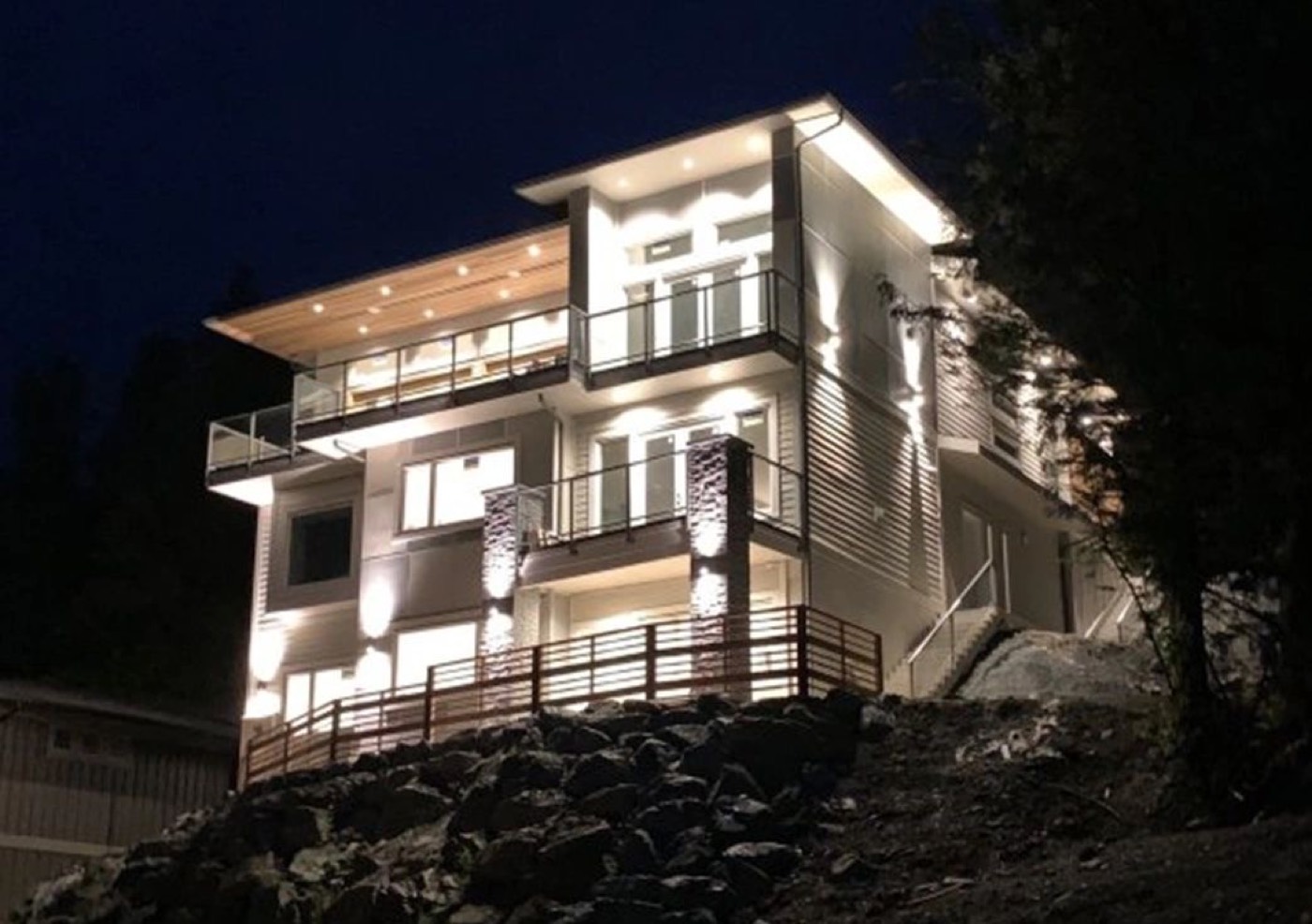 A completed modern home photographed at night
